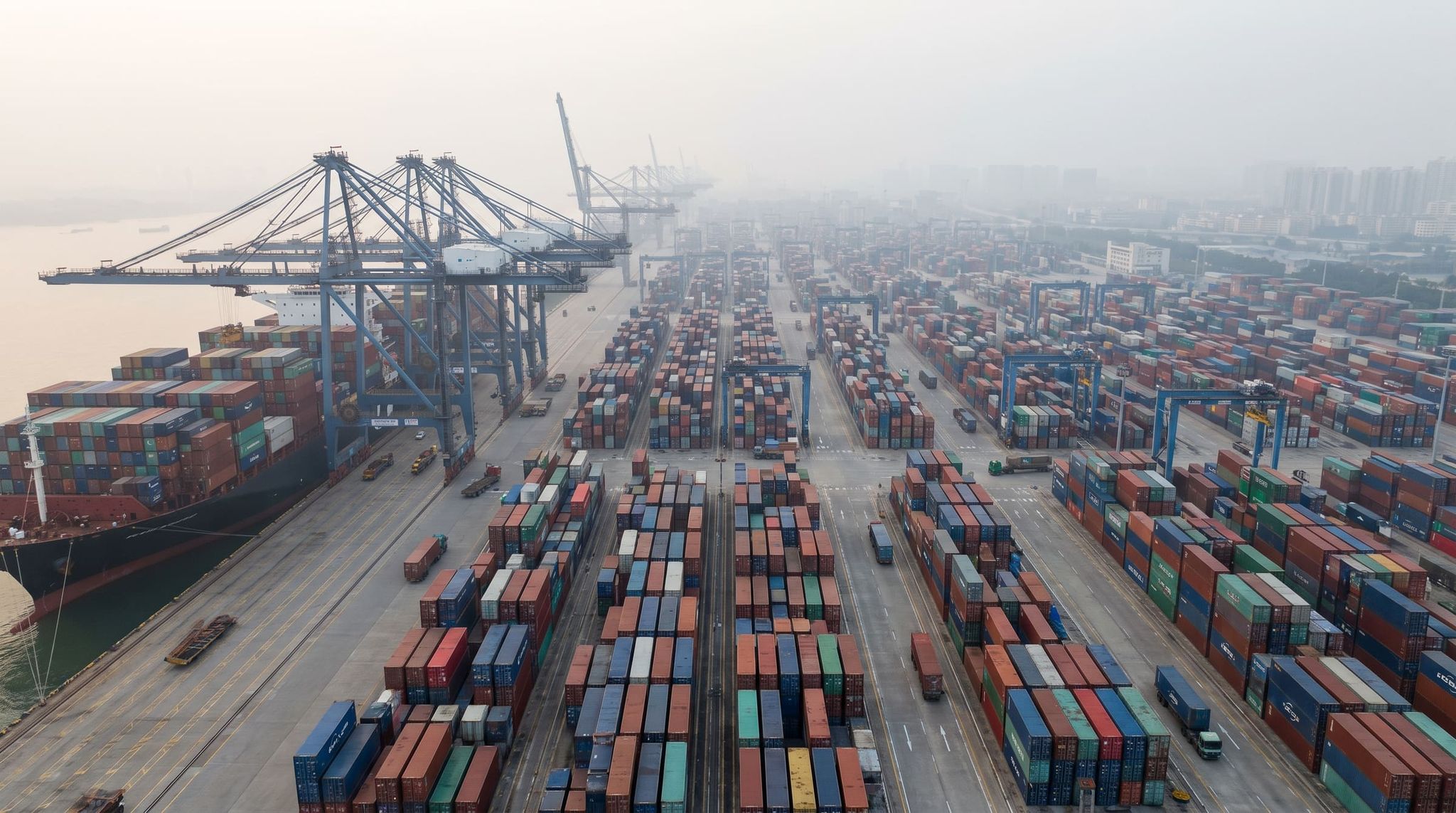 Container port in China with container ships and gantry cranes